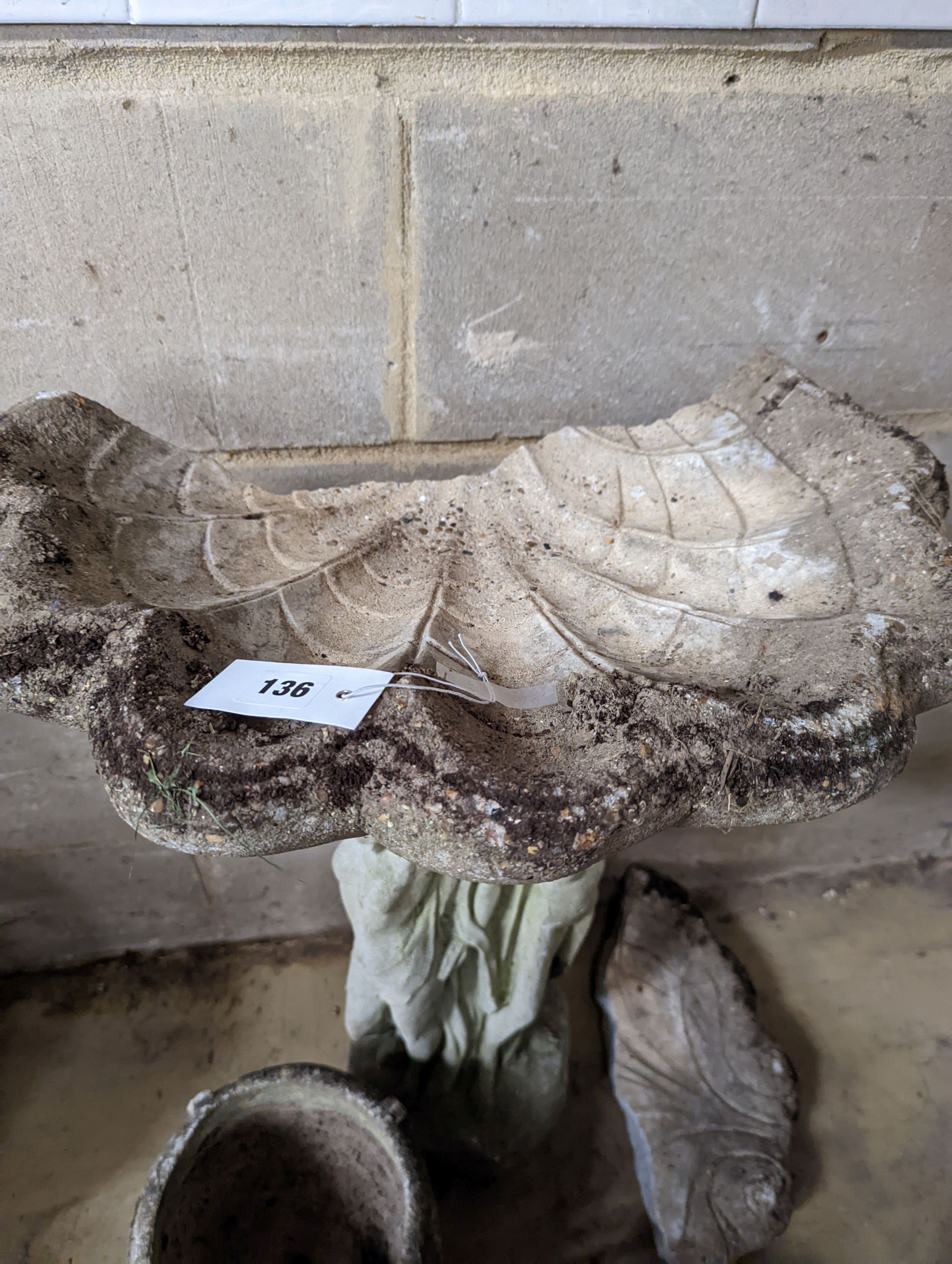 A reconstituted stone bird bath, (damaged) height 80cm together with two circular garden planters